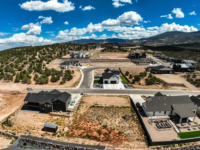 New construction community with paved roads and mountain backdrop