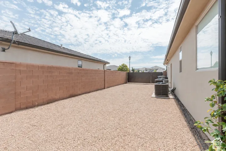 Side Yard: Gravel side yard along the block wall