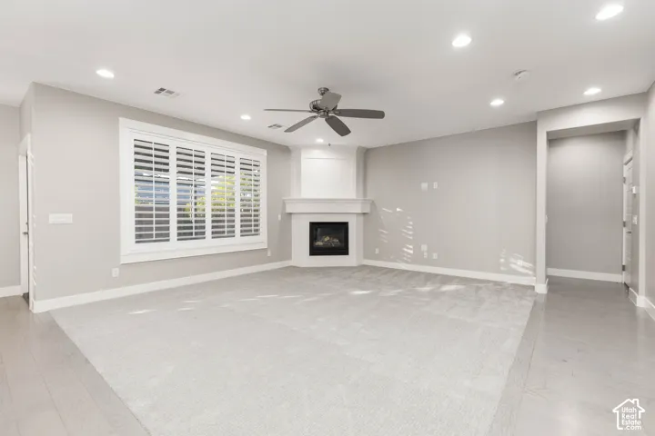 Living Room: Shown vacant to highlight the new carpet and corner fireplace