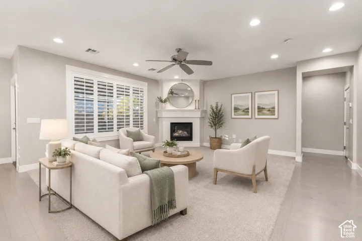 Living Room: New carpet, a corner gas fireplace, and plantation shutters