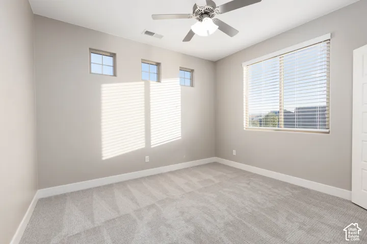 Bedroom: Upstairs bedroom with three transom windows and new carpet