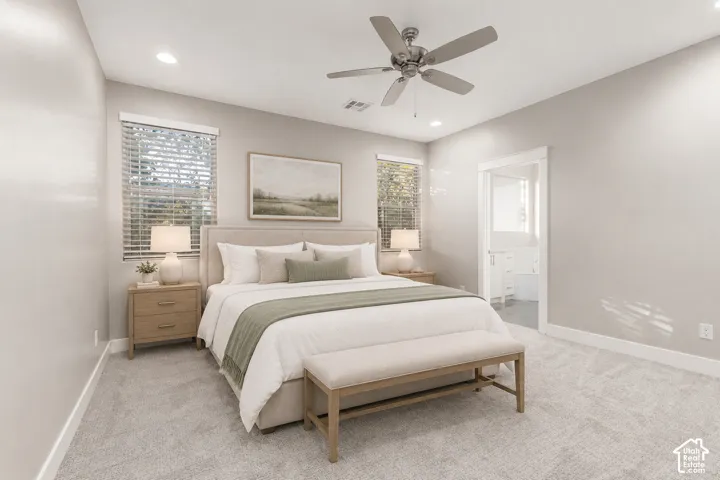Primary Bedroom: Main-floor primary suite with new carpet and a ceiling fan