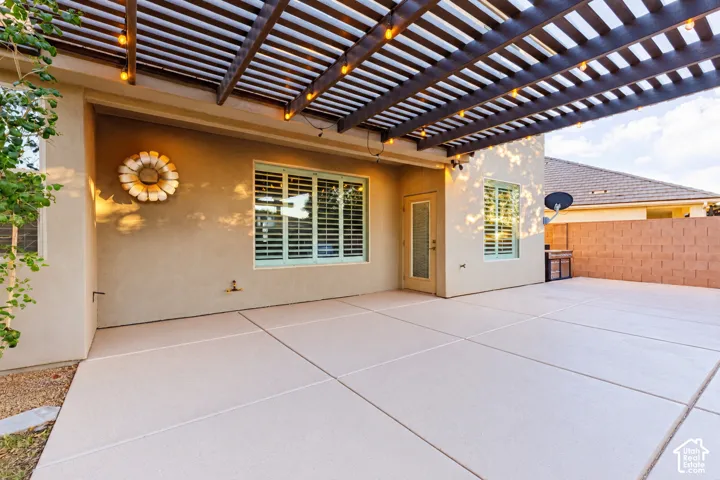 Patio: Covered patio off the dining room, shaded by the pergola