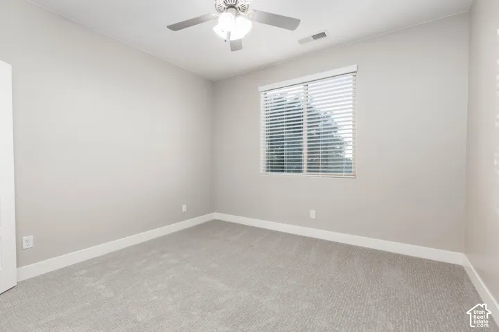 Bedroom: Upstairs bedroom with new carpet and a ceiling fan