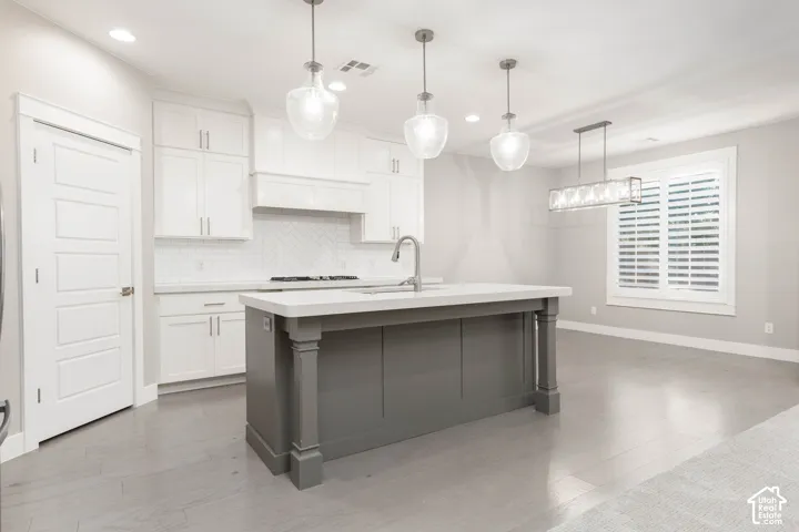 Kitchen: Shown vacant, open to the dining area beyond the island
