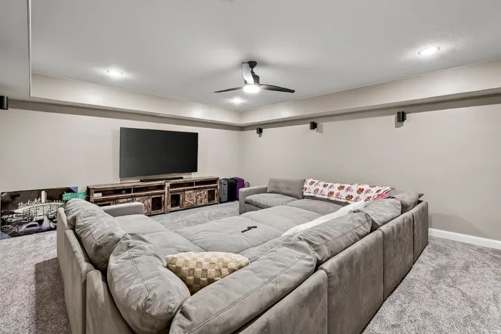 Recessed lighting, ceiling fan, and carpeted flooring