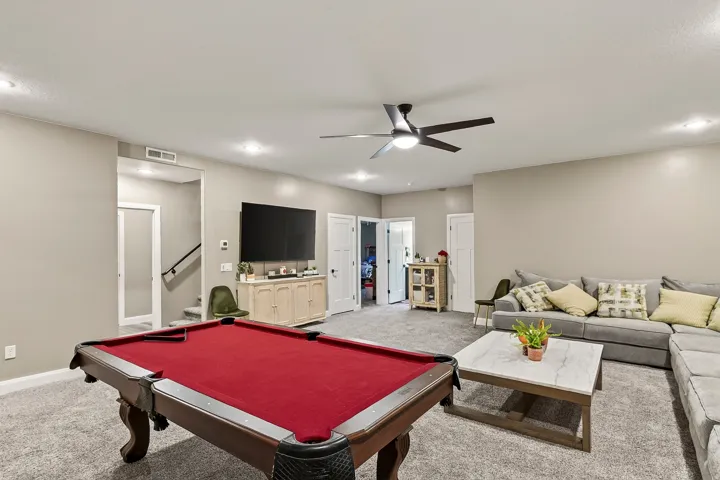 Recessed lighting, ceiling fan, and carpeted flooring