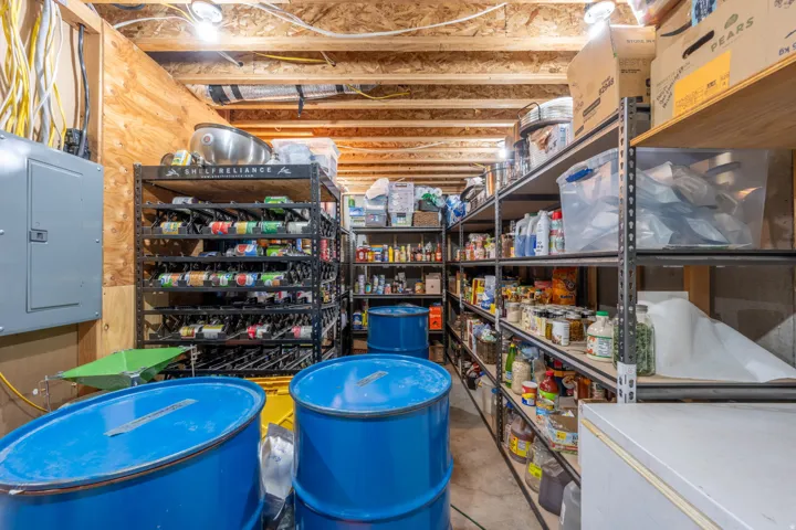 Organized storage facility featuring industrial-grade shelving units, climate-controlled cabinetry, and durable epoxy-coated flooring
