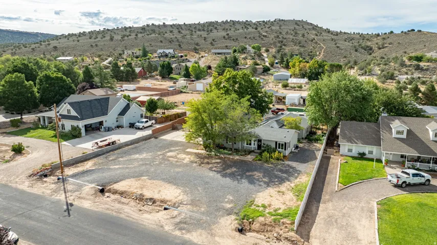Vacant lot situated in an established residential neighborhood with mature landscaping and tree coverage