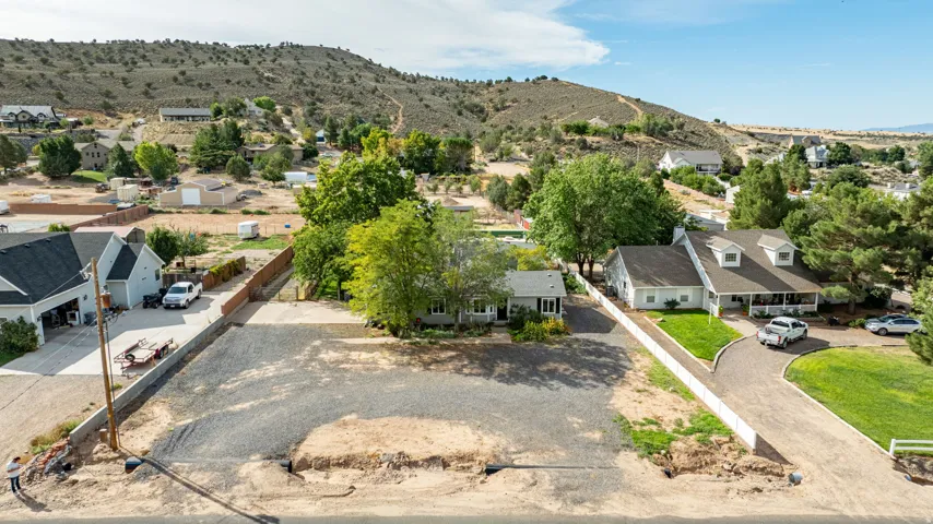 Spacious lot with mature landscaping and established trees providing natural shade throughout the grounds