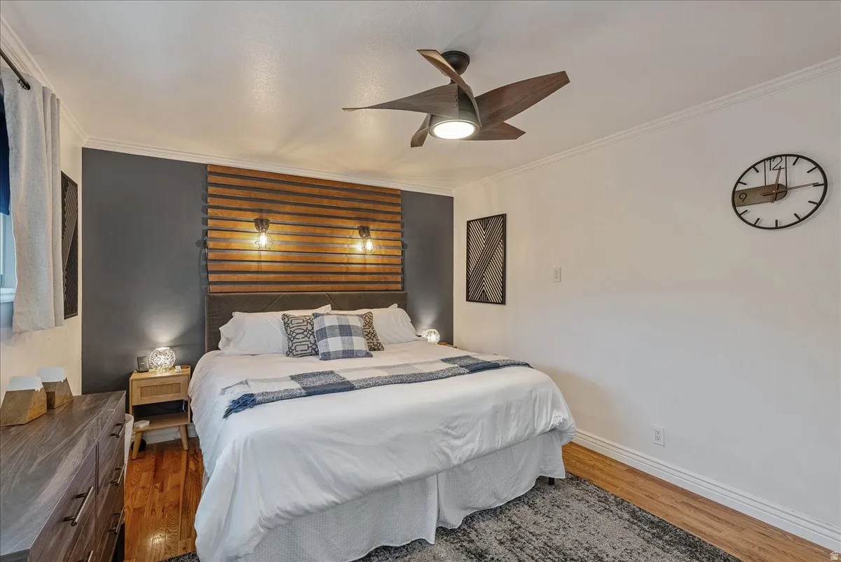 Accent wall with slat wood paneling and dark paint