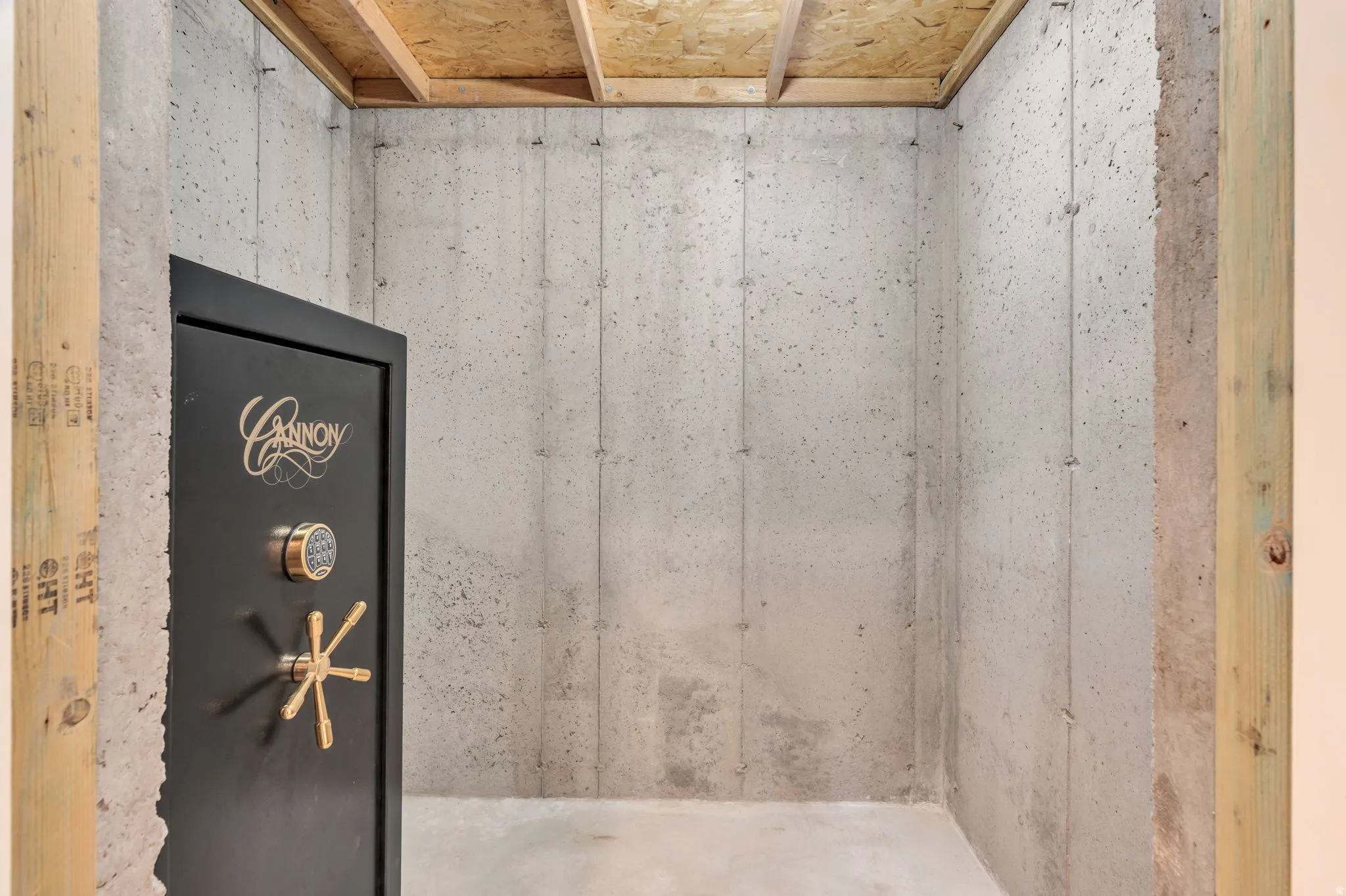 Concrete walls featuring a built-in safe