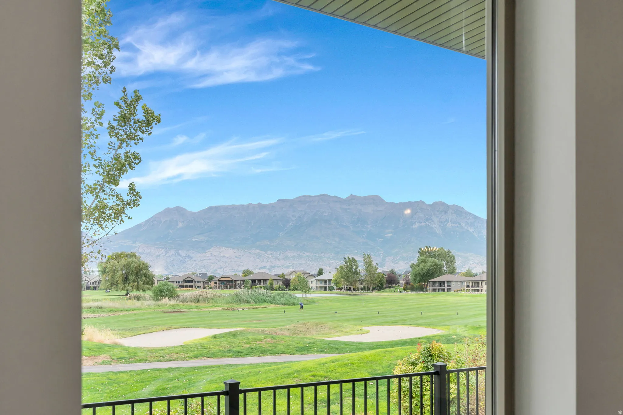 Expansive golf course frontage with mountain scenery