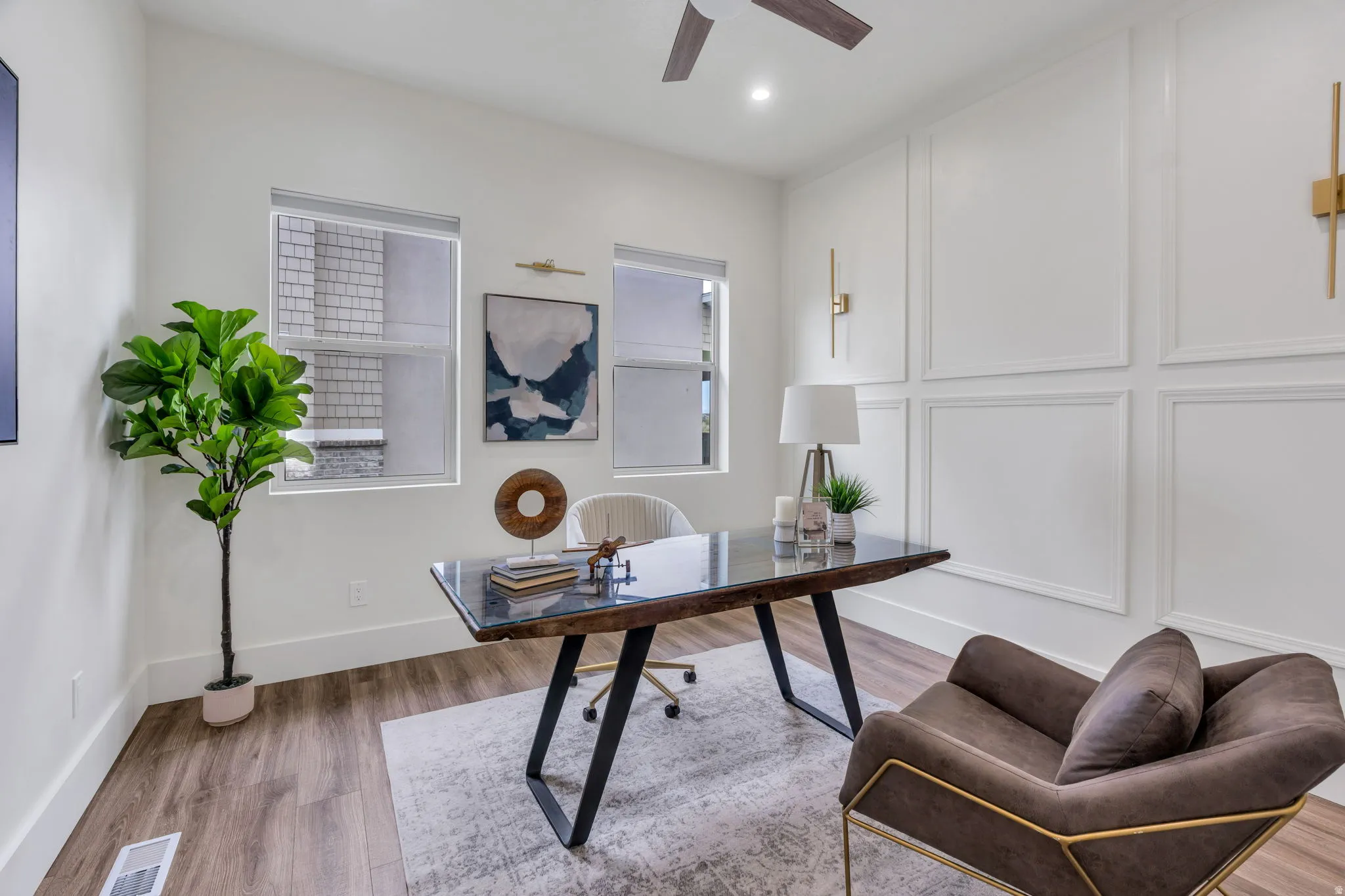 Wood-finish flooring, recessed lighting, and a ceiling fan