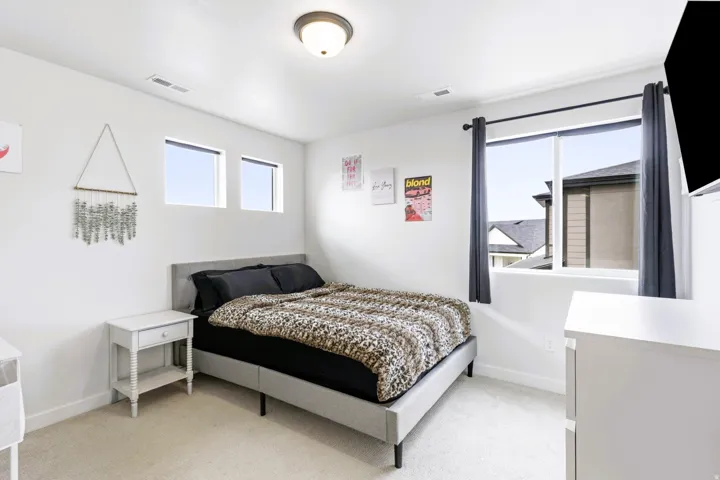 Bedroom #2 Bright with light-toned carpeting and white walls