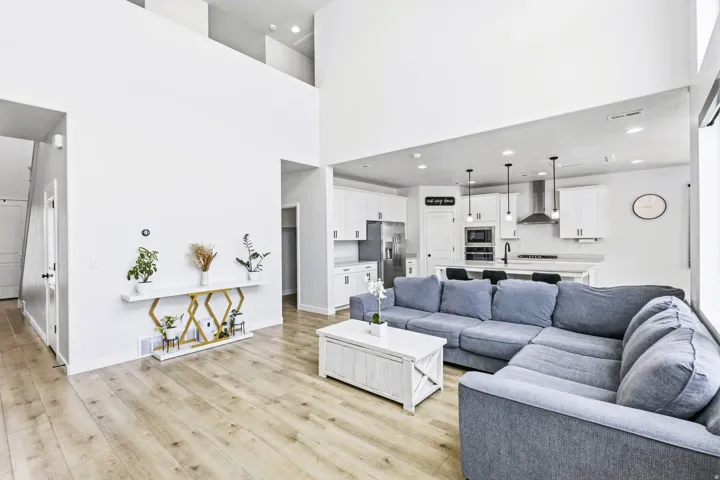 High ceilings, wood-finish flooring, and pendant lighting