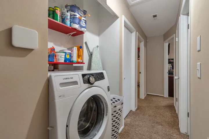 Laundry area with built-in shelving