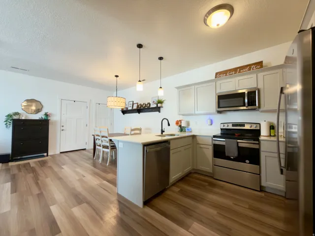Kitchen, dining & entry areas with LVP flooring