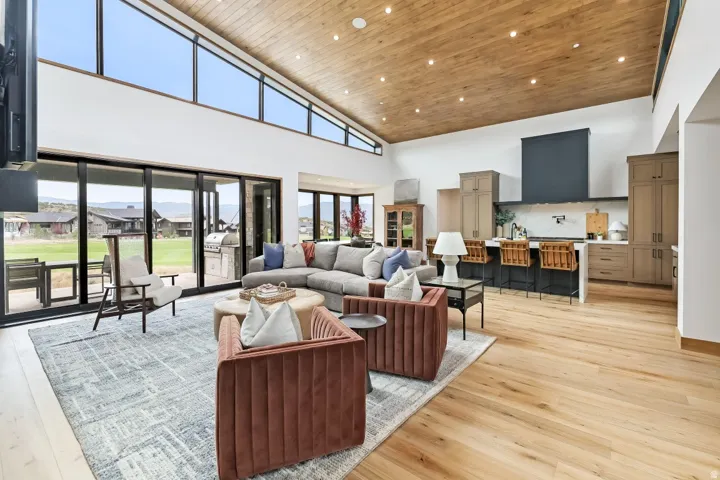 Vaulted wood-paneled ceiling with recessed lighting