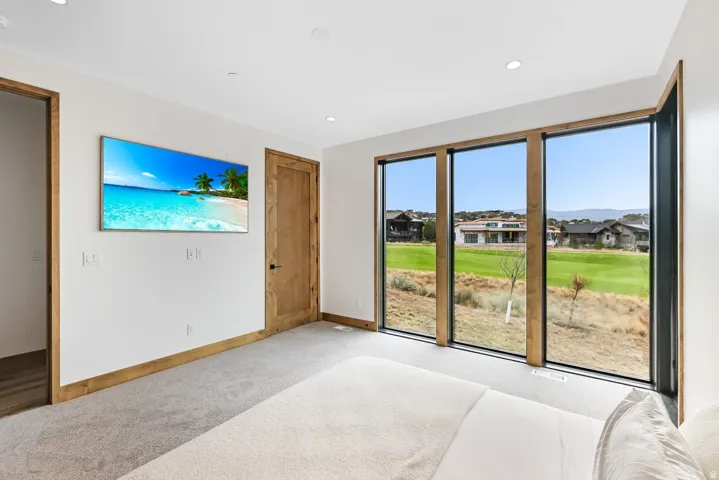 Expansive wall-to-wall windows with wood-finish trim