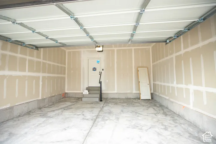 Two car garage with taped finish.