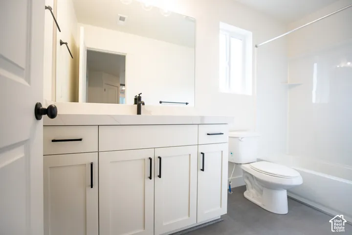 Full secondary bath with painted white wood cabinets and quartz slab countertops.