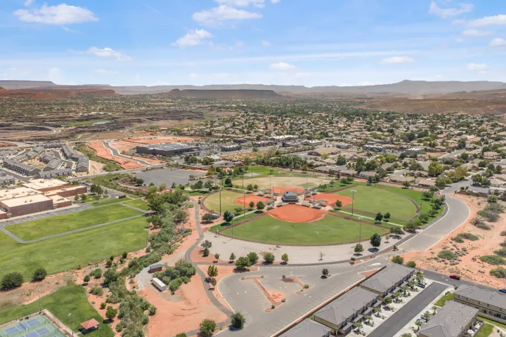 Expansive community featuring multiple baseball fields, surrounding residential areas, and desert landscaping