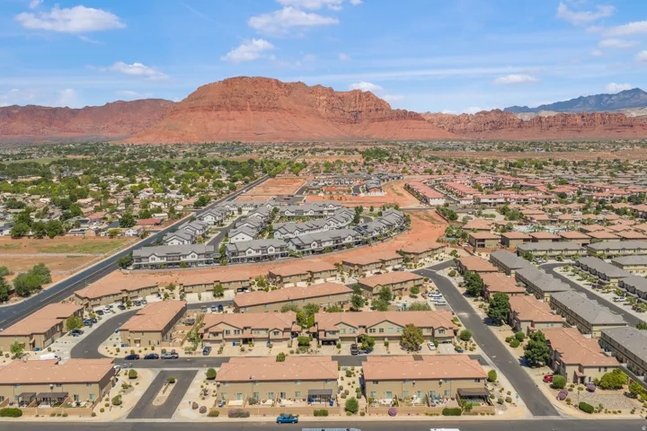 Expansive neighborhood setting with established residential properties and undeveloped land