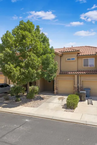 Stucco exterior with a tiled roof