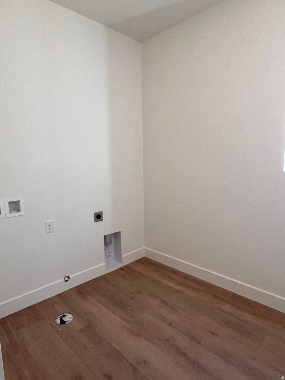 Wood-finish flooring with white wall finishes