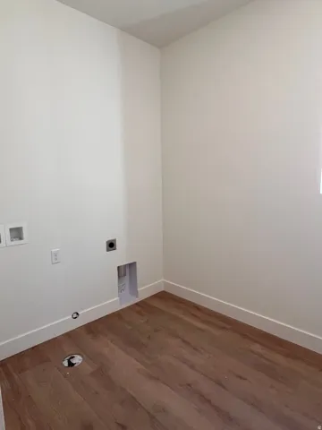 Wood-finish flooring with white wall finishes