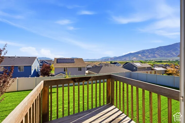 Wood deck with railing, providing an elevated outdoor living space