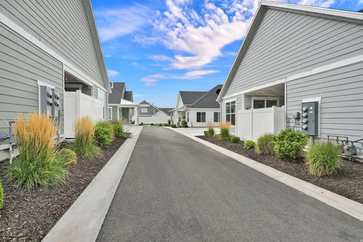 Community street with asphalt paving and concrete curbing