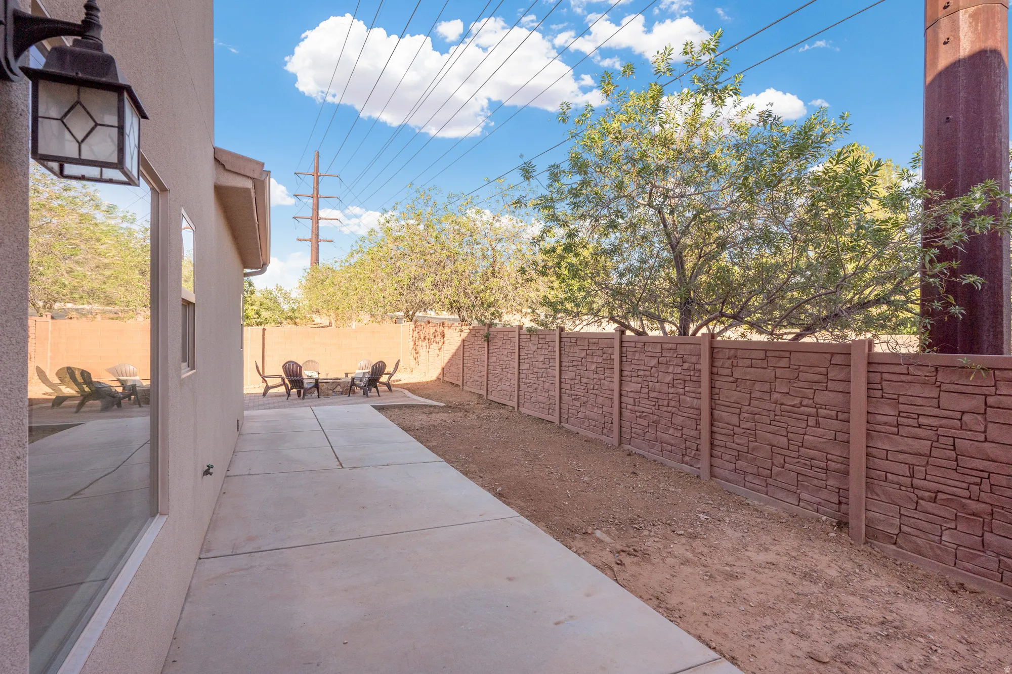 Stucco exterior with an attached outdoor lantern
