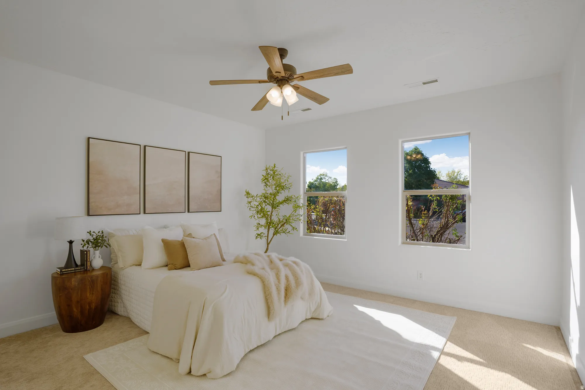 White wall finishes, recessed lighting, ceiling fan with light fixture, two windows, and carpeted flooring