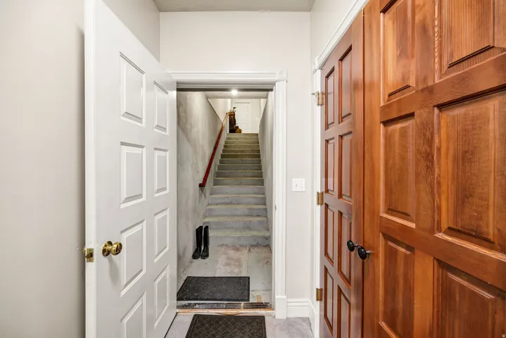 White paneled door with brass hardware