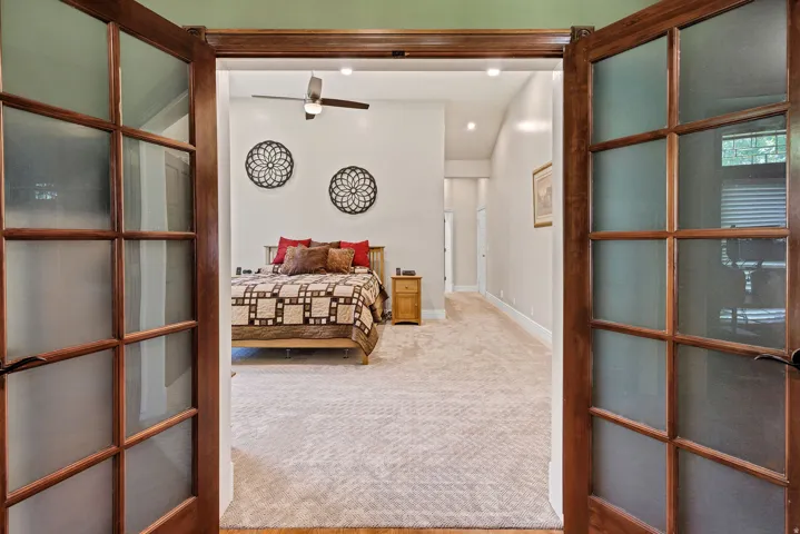French doors with frosted glass panels, wood-finish flooring, recessed lighting, and a ceiling fan