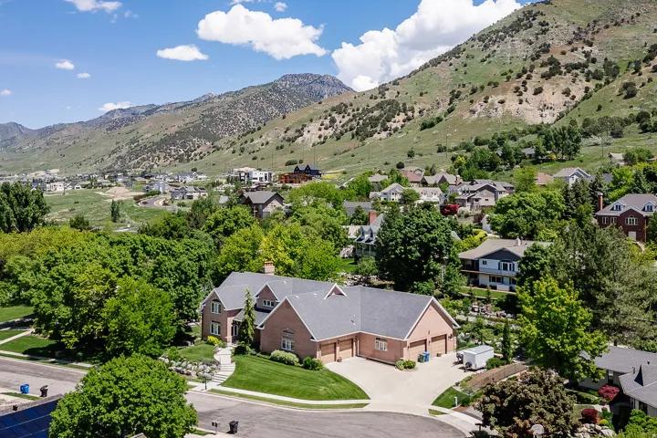 Brick exterior with gabled roofing and multiple dormer windows