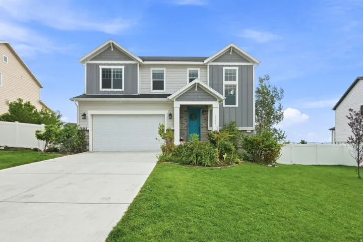 Two-story exterior with mixed siding and stone accents