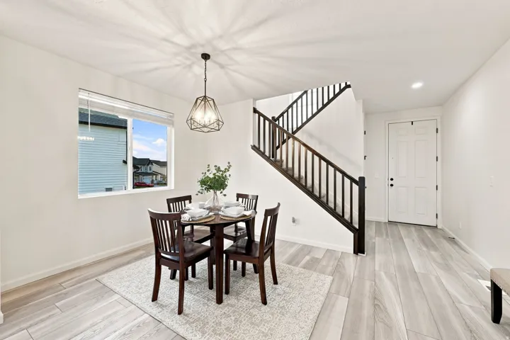 Hard-surface flooring, white walls, and a contemporary geometric pendant light