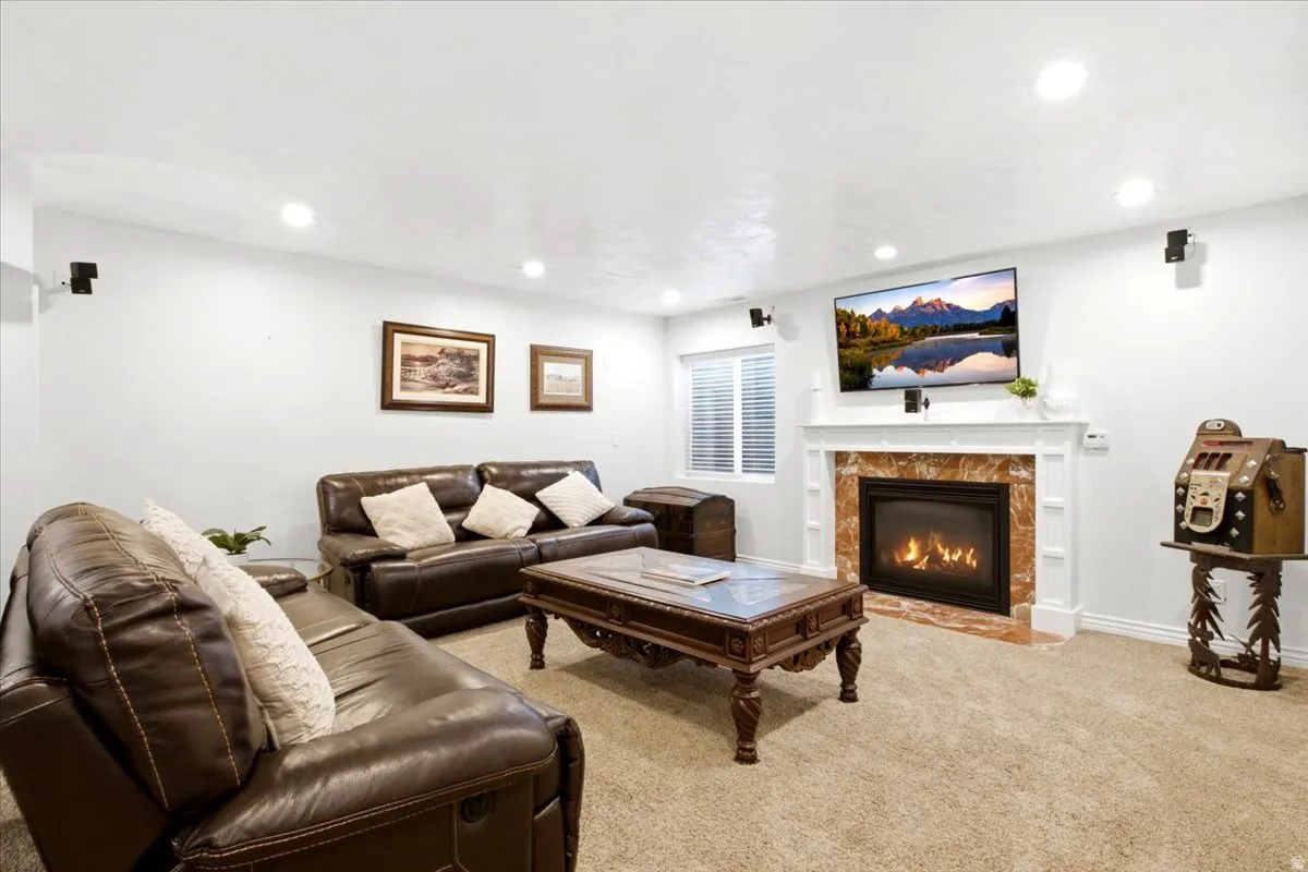 Built-in gas fireplace with a decorative mantel and stone surround