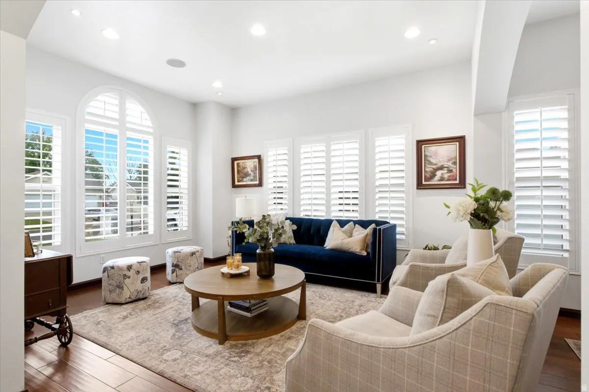 Arch-top window with plantation shutters
