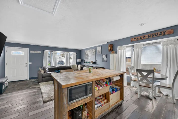 Wood-finish flooring throughout, with a recessed ceiling light fixture