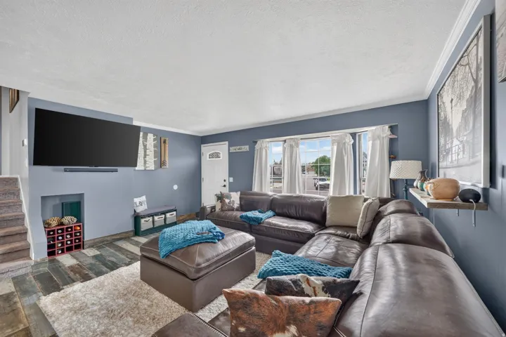 Living area with wood-finish flooring and a built-in recessed storage niche