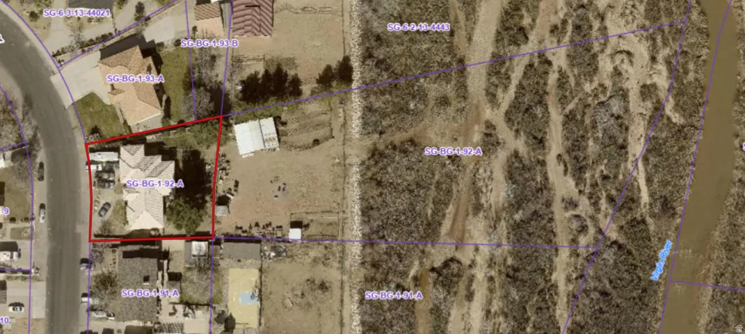 Property Parcel Map. Illustrating the property's boundary and surrounding parcels, including undeveloped land and a water feature