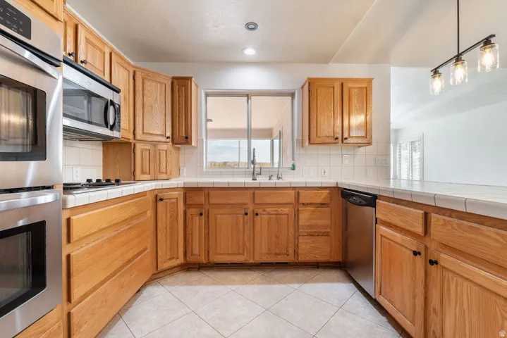 Stainless steel wall oven, built-in microwave, and dishwasher