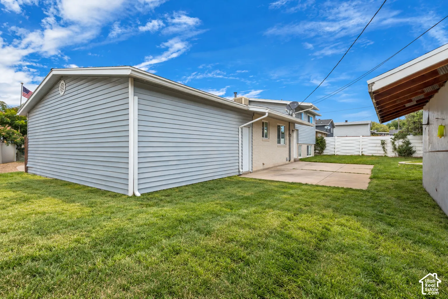 Exterior featuring horizontal siding, a concrete patio, and fenced backyard grounds