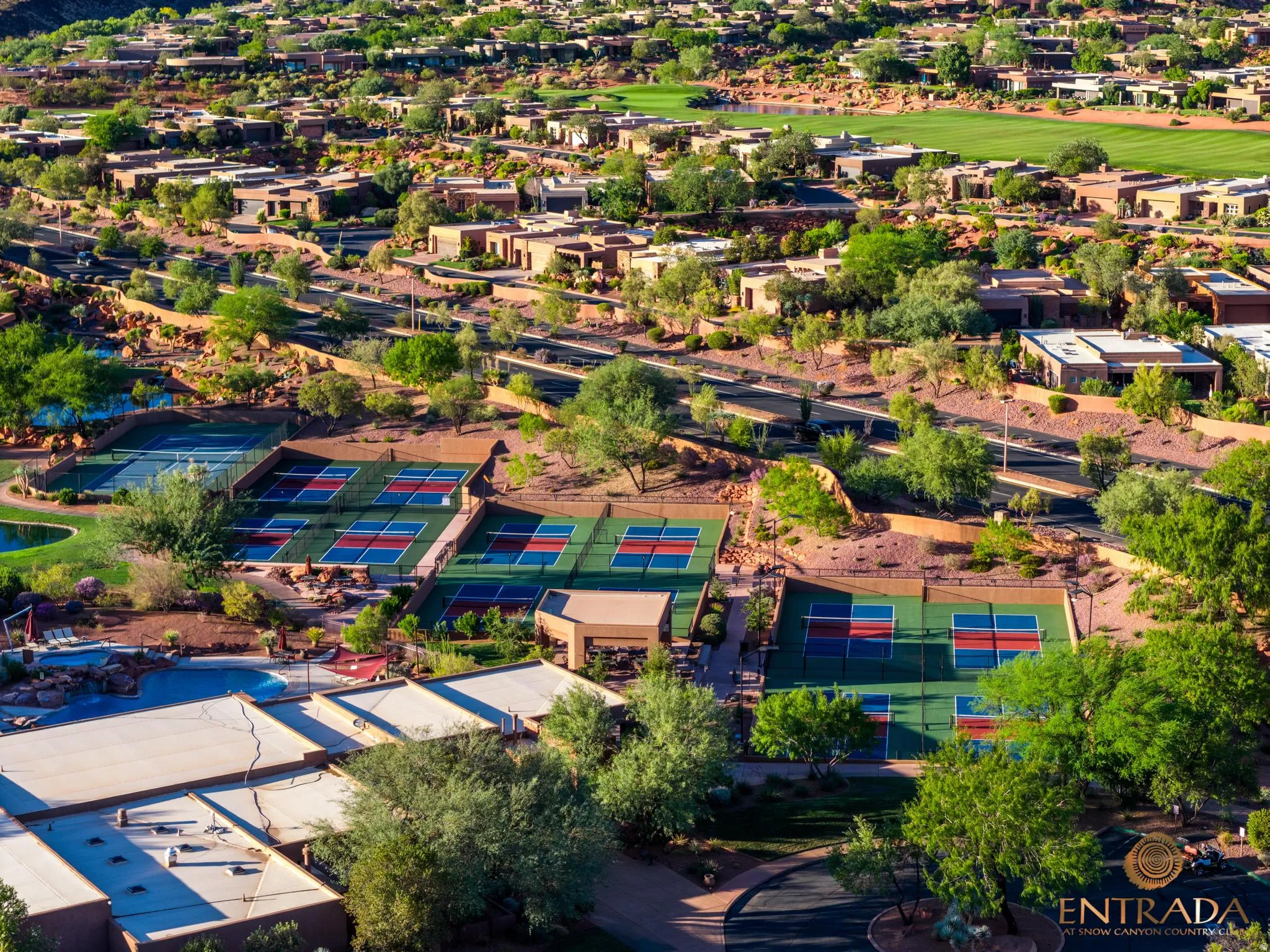 Multiple tennis courts, dedicated pickleball courts, and a community pool with surrounding lounge areas