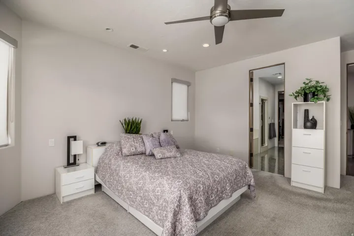 Recessed lighting, ceiling fan, and carpeted flooring