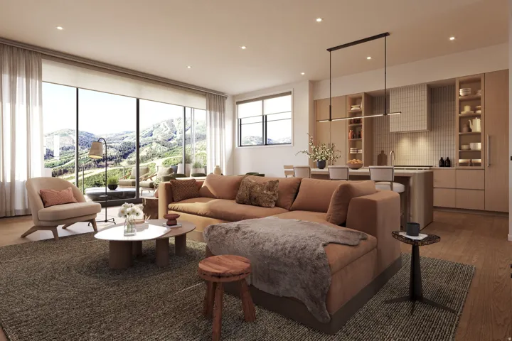 Open-concept living space with a gourmet kitchen featuring integrated appliances, light wood-finish cabinetry, and a full-height tile backsplash